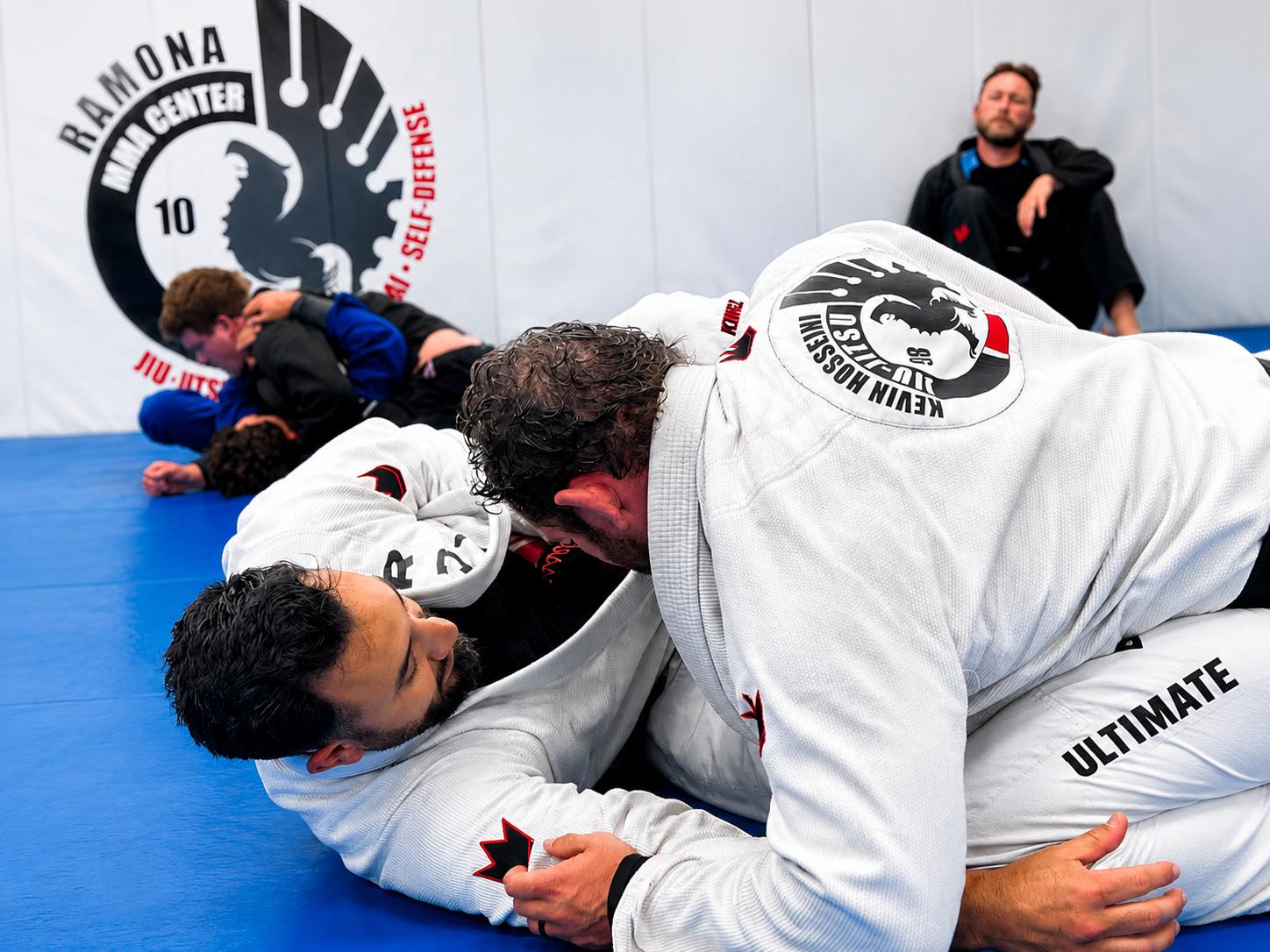 Brazilian Jiu-Jitsu class at Ramona MMA Center, students rolling in gis